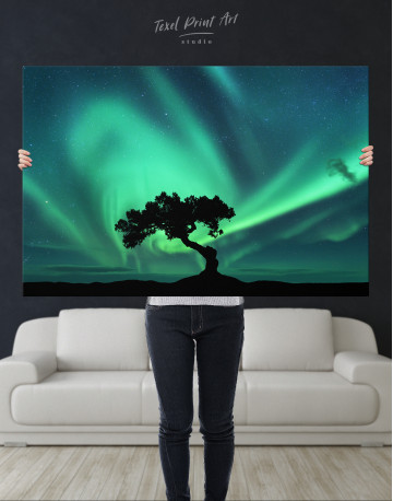 Aurora Borealis and Silhouette of a Tree Canvas Wall Art - image 1