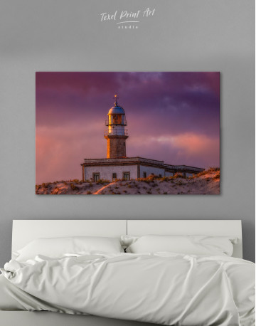 Lighthouse Under a Cloudy Sky Canvas Wall Art