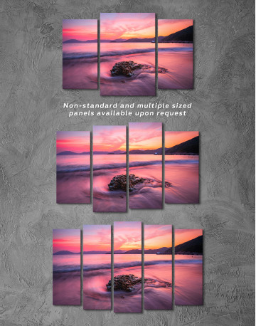 Rock in a Wavy Sea under an Orange and Pink Sky at Sunset Canvas Wall Art - image 4