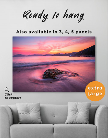 Rock in a Wavy Sea under an Orange and Pink Sky at Sunset Canvas Wall Art - image 2